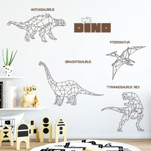 Detail view of geometric dinosaur wall decals featuring T-Rex and DINO text on white wall