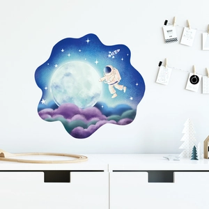 Detailed astronaut wall sticker with moon and stars in a modern kid room decor