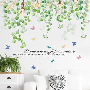 Fresh green hanging plants and colorful butterfly wall stickers for living room decor