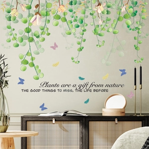 Nature wall sticker featuring green leaves, pink flowers and butterflies for living room decor