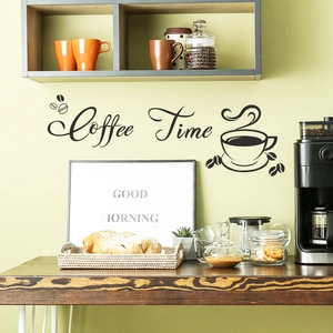 Close-up of Coffee Time vinyl wall decal with coffee cup silhouette in a cozy kitchen