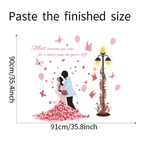 Detail view of cartoon couple wall sticker showing 91cm x 90cm dimensions and pink butterflies