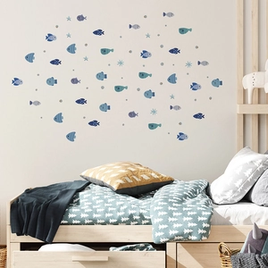 Detailed view of ocean theme fish and starfish wall decals in a Nordic kids bedroom decor