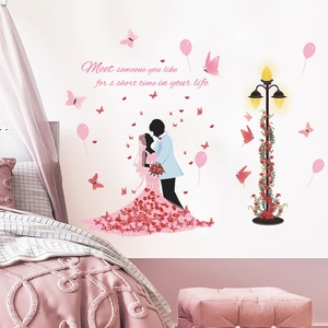 Romantic bedroom wall decal featuring couple silhouette, pink butterflies and balloons