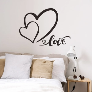 Romantic black heart and love lettering wall sticker applied on a bedroom background