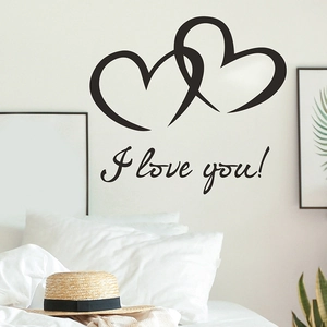 Modern black interlocking heart wall stickers with I love you text on bedroom wall