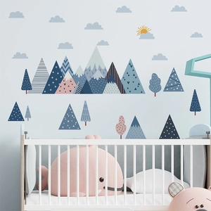 Nursery wall sticker set with geometric mountains, clouds and trees in soft pastel colors