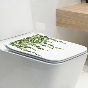 Detail of green ivy leaf decal on white toilet lid for bathroom wall home decoration