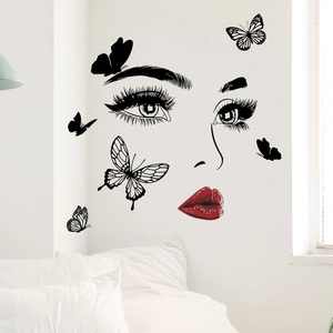Detailed wall sticker featuring feminine eye silhouettes and red lips with butterflies