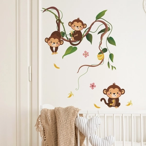 Detail showing cartoon monkeys and green vines wall stickers in a cozy child nursery room