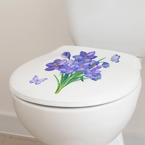 Detail of purple flowers and butterfly self-adhesive decals on a white toilet lid