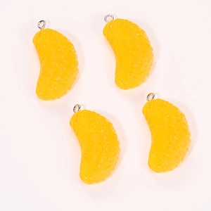 Detailed close-up of realistic resin orange slice pendants with metallic loops