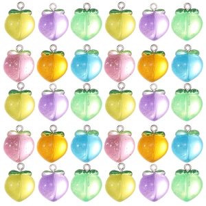 Colorful resin peach pendants in a grid layout for DIY keychain and jewelry making