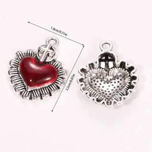 Detailed front and back views of heart charms with red oil drip and cross top