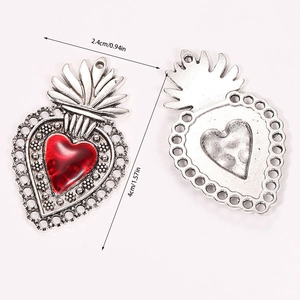Detailed front and back view of retro gothic sacred heart pendant with red enamel