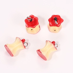 Detailed macro view of four realistic resin apple core charms for DIY handmade jewelry