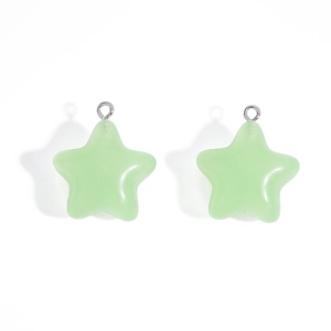 Detail of light green jelly star charms with silver rings for DIY jewelry and keychains