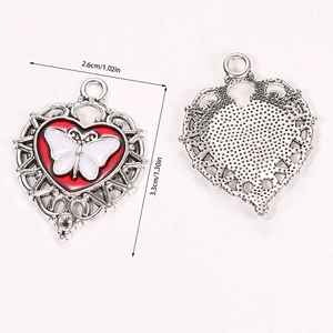 Detailed front and back view of silver Gothic heart pendant with a white butterfly