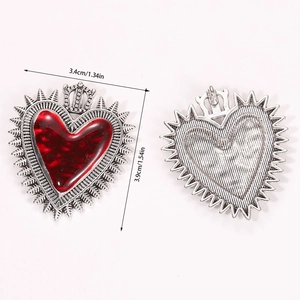 Detailed front and back view of a gothic sacred heart pendant with silver metal texture