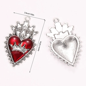 Detail of red gothic sacred heart pendant with dimensions and silver metallic texture