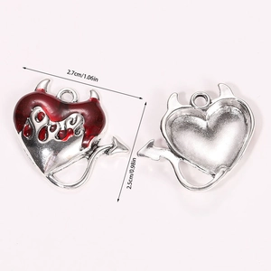 Detail of red enamel heart pendant with devil horns showing front and back size 2.7x2.5cm