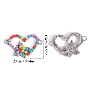 Detailed view of heart-shaped butterfly connector with colorful resin beads for DIY jewelry