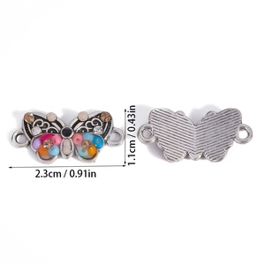 Detail view of butterfly connector with colorful beads and 2.3cm x 1.1cm dimensions