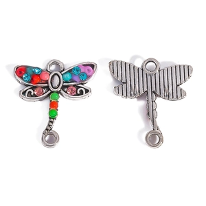 Front and back detail of a dragonfly jewelry connector with multi-color crystal inlay