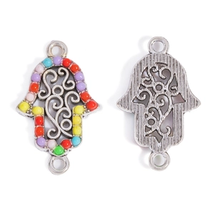 Detailed view of Hamsa hand connector with colorful resin beads and antique silver finish