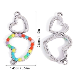 Detailed macro view of heart-shaped colorful resin connector charm with silver finish