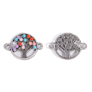 Detail of tree of life jewelry connector with colorful beads and textured silver back
