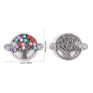 Detail of Tree of Life connector charms with colorful resin dots and antique silver finish