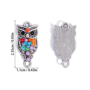 Front and back detail of owl resin charms with colorful beads and vintage silver finish