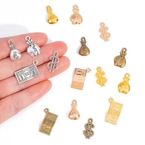 DIY jewelry pendants featuring dollar signs, money bags and bills in multiple metal finishes