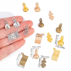 DIY alloy jewelry pendants featuring dollar signs, money bags and bills in mixed metallic tones