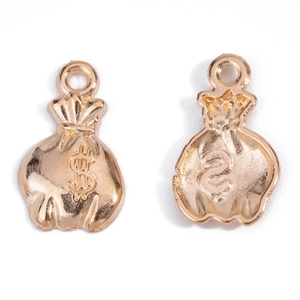 Detailed view of golden money bag pendants with dollar sign for DIY jewelry making