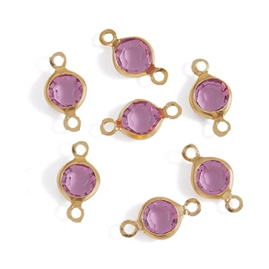 Detail of pink faceted glass connectors with gold plated edges for DIY jewelry making