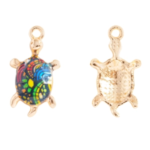 Detailed macro view of colorful enamel turtle charms showing front shell and back texture