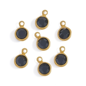 Macro view of seven pieces round gold-plated copper glass pendants for DIY jewelry