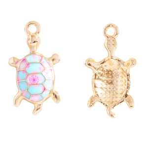 Detail of blue floral enamel turtle charm showing front and textured gold alloy back