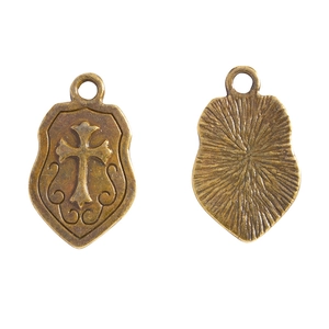 Antique bronze shield pendant with cross relief and radial texture pattern