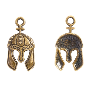 Front and back detail of an antique bronze Spartan helmet pendant with relief patterns