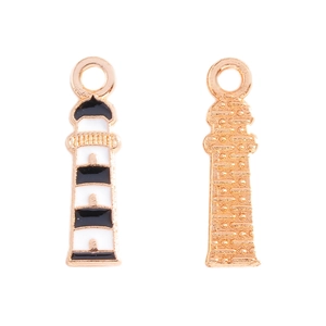 Detail of lighthouse alloy charms with black and white enamel finish for DIY jewelry