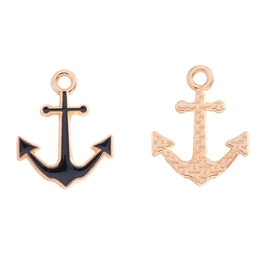 Detail of anchor charm showing black enamel front and textured gold back for DIY jewelry