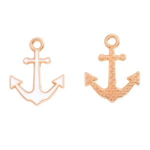 Detail showing the white enamel front and textured gold-plated back of anchor charms