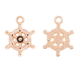 Detail of nautical ship wheel alloy charms with white enamel and textured reverse side