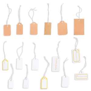 Assorted white and kraft paper jewelry tags with elastic strings for price labeling