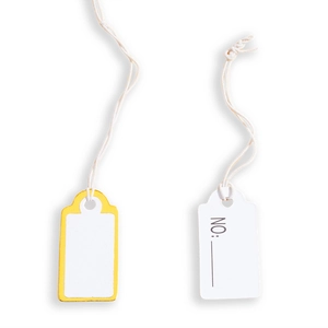 Macro shot of blank price tags with yellow border and NO: label on white background
