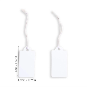 Macro shot showing 4cm by 1.9cm white paper tags with string for price labeling