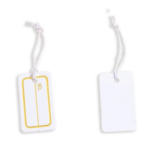 Detail of rectangular paper tags with white cotton strings and yellow border printing